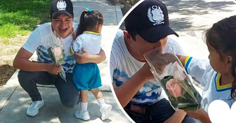 Padre espera a su hija con flores el primer día de clases